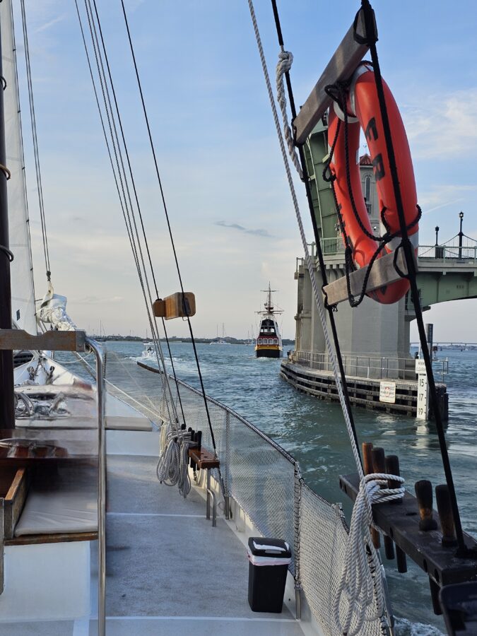 Boat Rides St Augustine FL: The One Experience We Never Skip 5 View from the Schooner Freedom sailing under the Bridge of Lions in St. Augustine FL, with other boats passing on the water. A peaceful scene from one of the best boat rides in St Augustine FL.