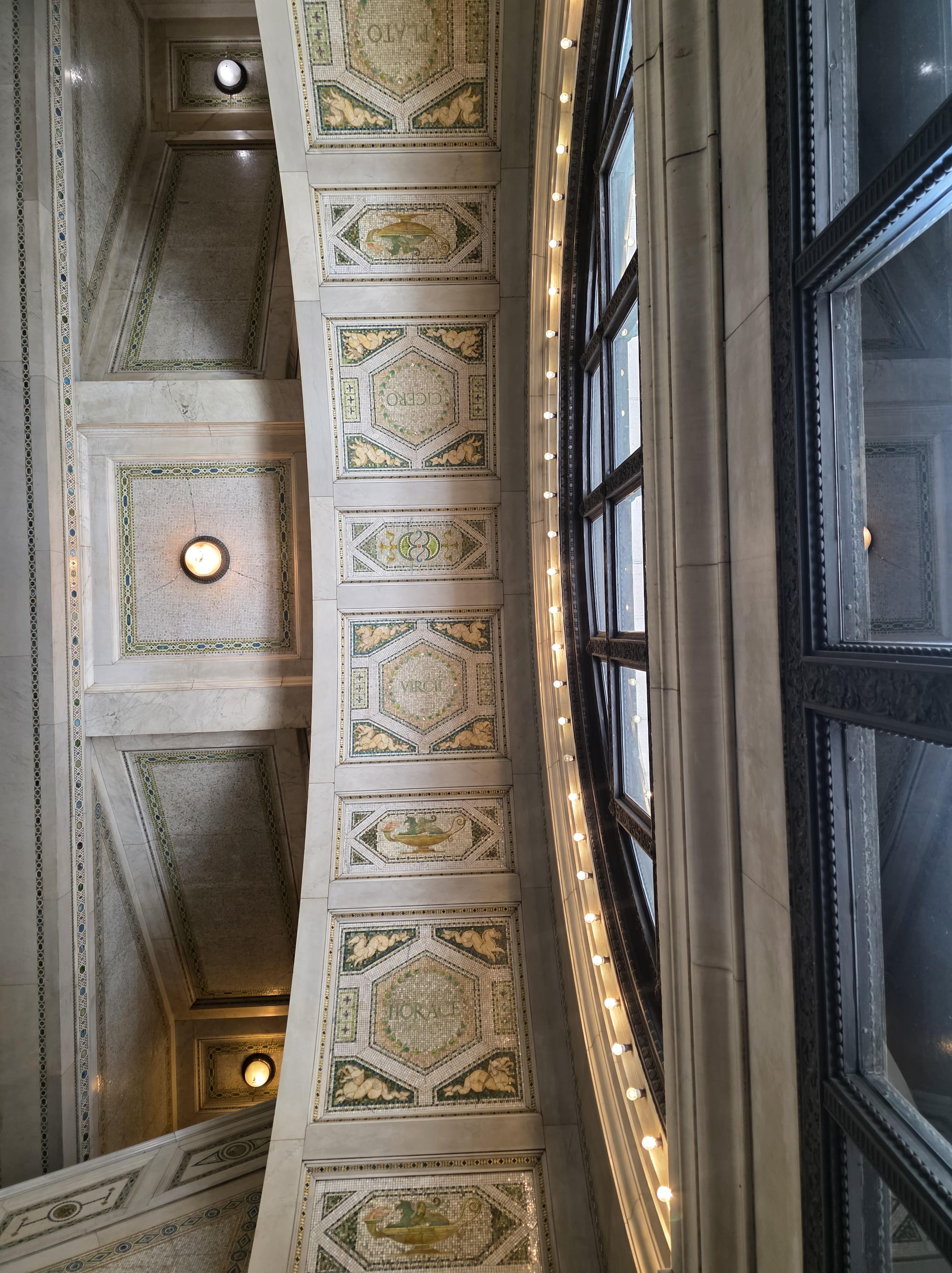 Chicago Cultural Center: Free Things to Do Near Millennium Park 6 Looking upward through the iconic stairwells and golden tile ceilings of the Chicago Cultural Center.