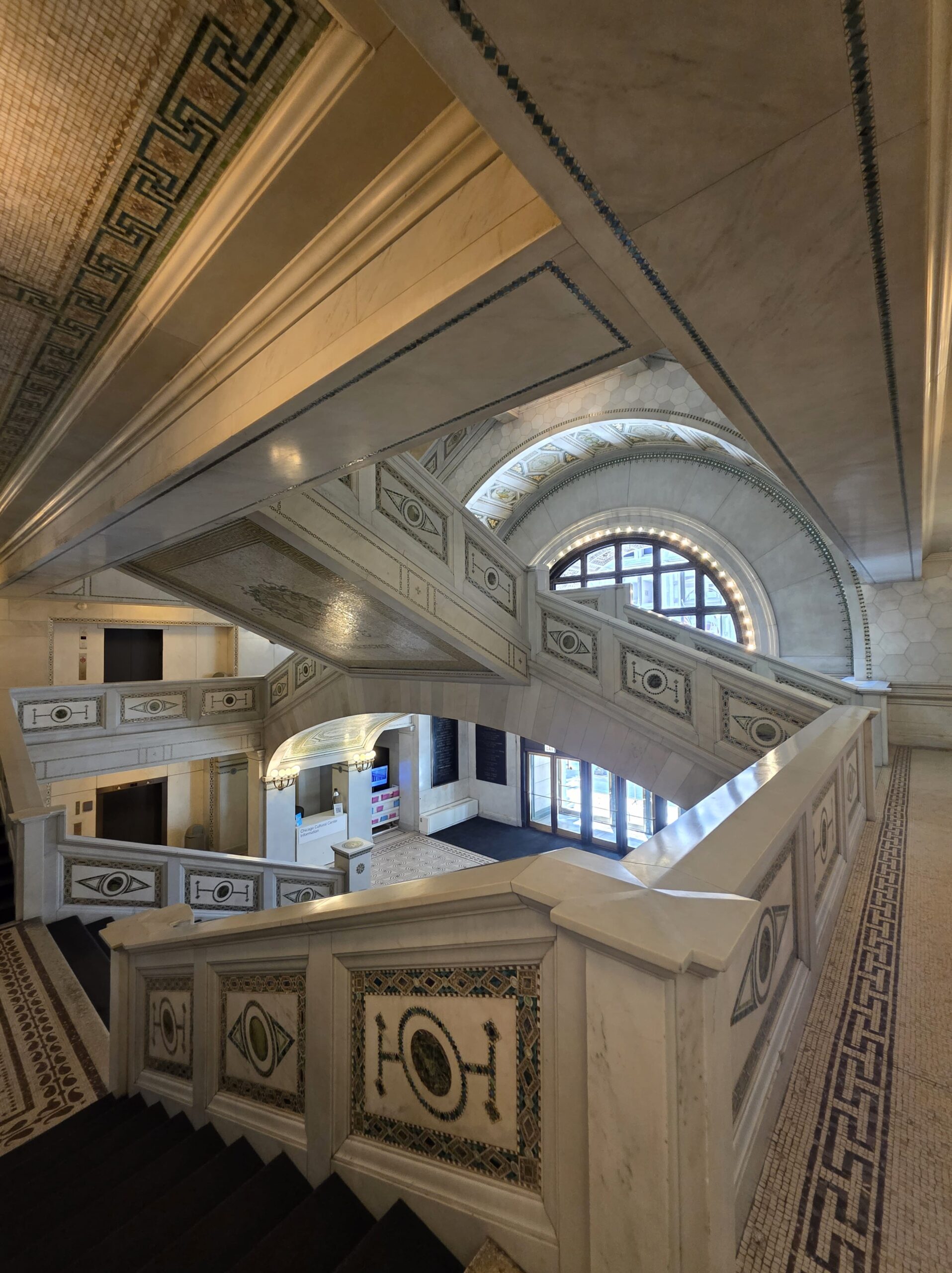 Chicago Cultural Center: Free Things to Do Near Millennium Park 2 Intricate marble staircase and detailed mosaic accents inside the historic Chicago Cultural Center.